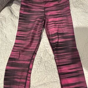 Nike Pink and Black Striped cropped leggings.